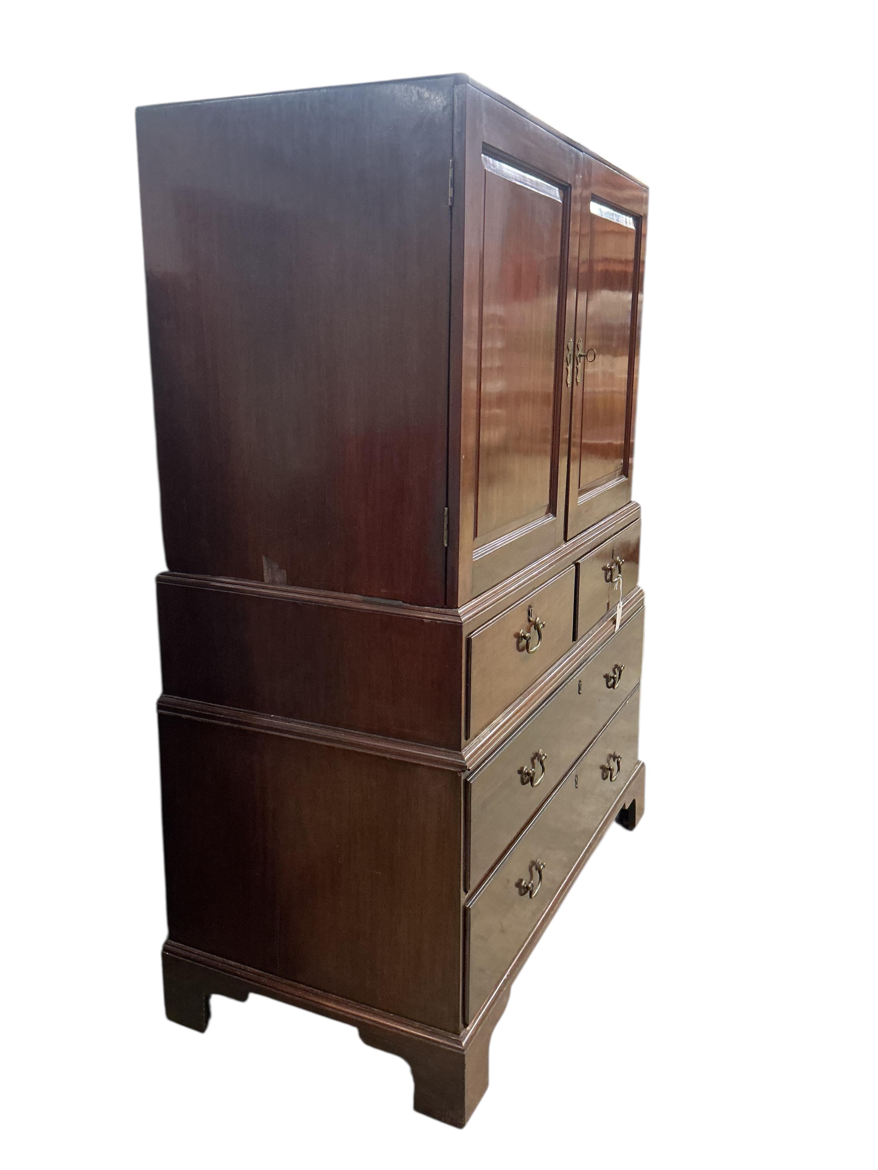 A George II mahogany three part linen press, width 122cm, depth 62cm, height 166cm